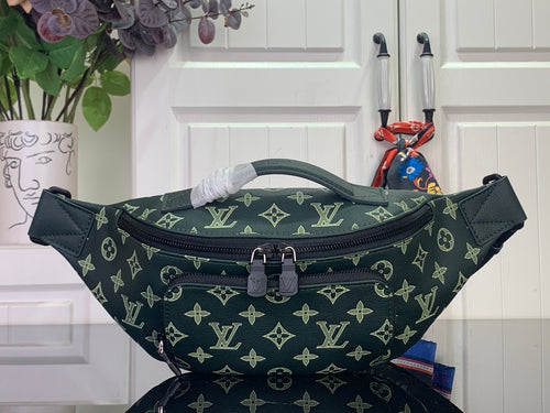 Louis Vuitton monogram bag in dark green with top zipper and adjustable strap