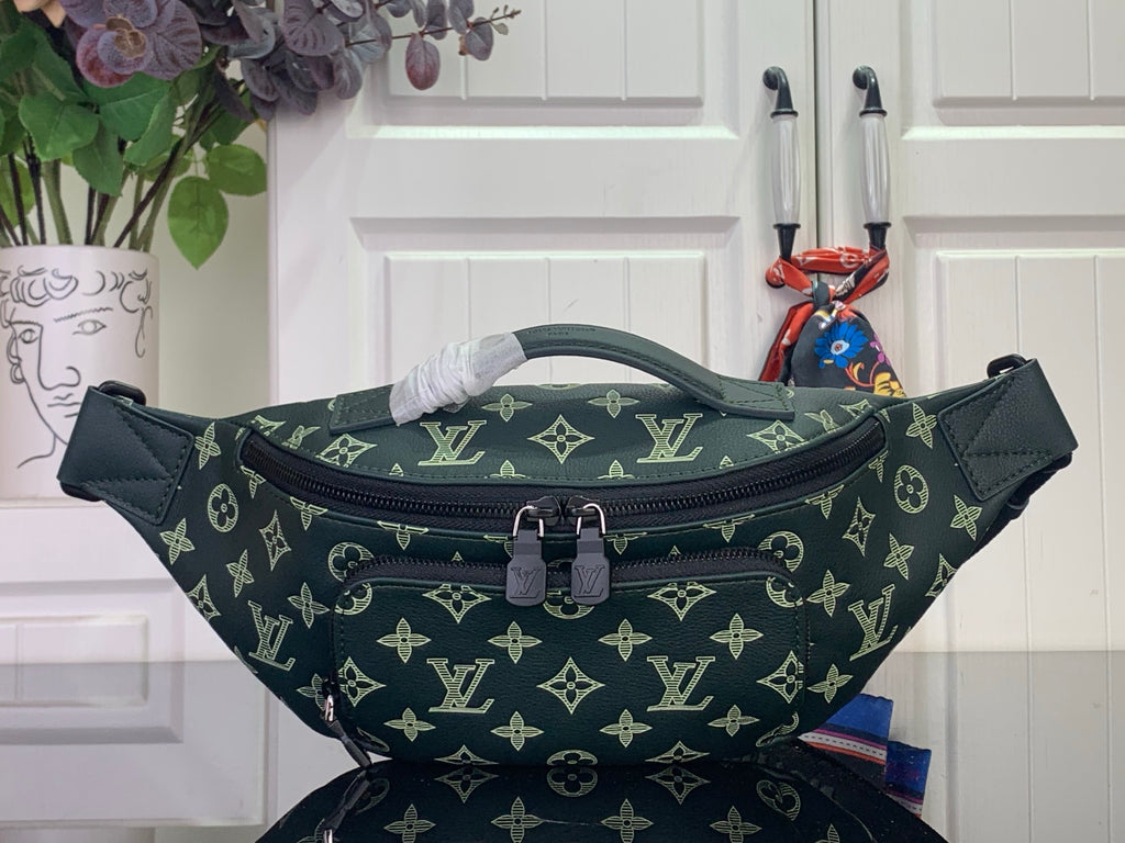 Green monogram belt bag with top zip and adjustable strap