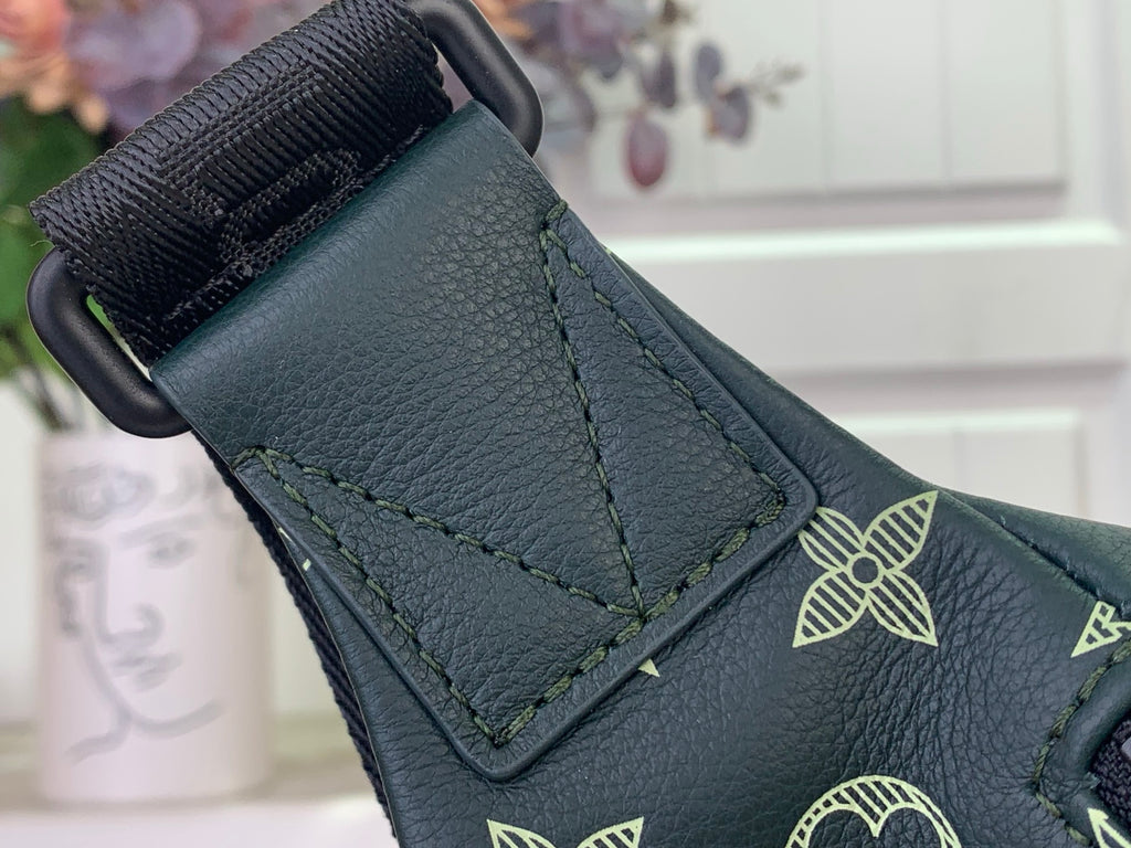 Louis Vuitton monogram bag corner with leather patch and strap attachment