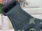 Louis Vuitton monogram bag corner with leather patch and strap attachment