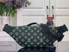 Green monogram belt bag with side straps and zipper pull
