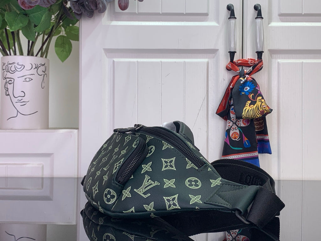 Louis Vuitton monogram bag, dark green exterior with zip closure and shoulder strap