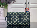 Louis Vuitton monogram pouch, dark green with gold pattern, side strap visible