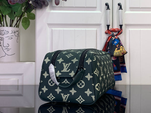 Louis Vuitton monogram shoulder bag with flap, dark green and gold logo pattern