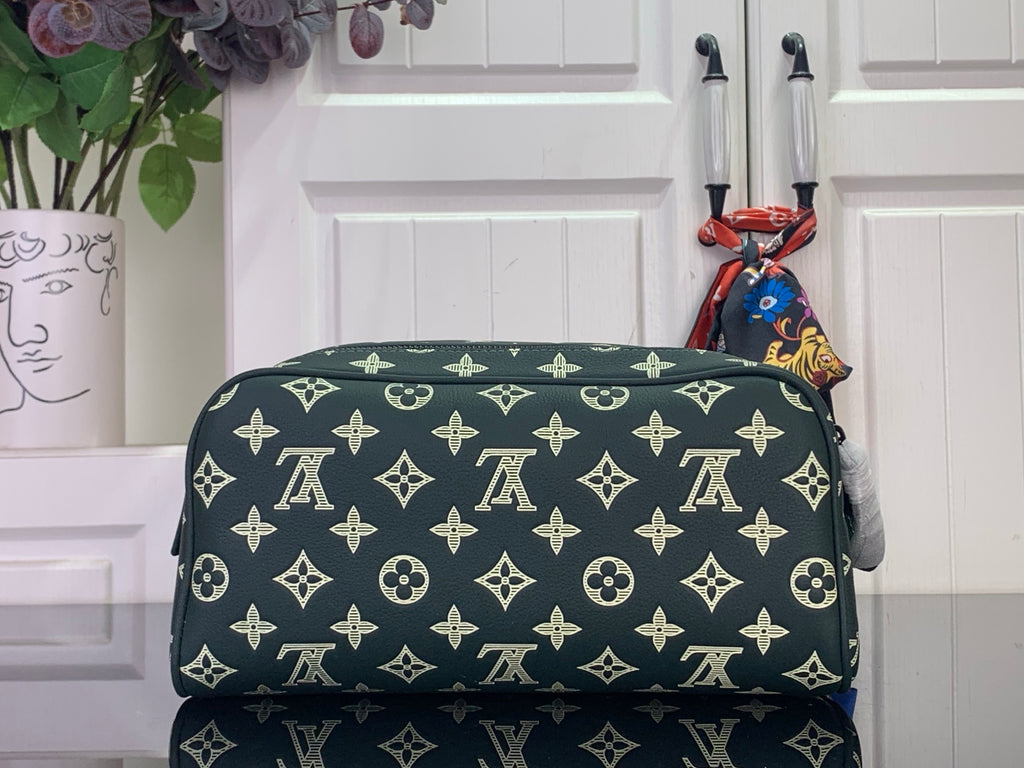 Louis Vuitton monogram toiletry bag with gold pattern, dark green, zip closure