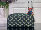Louis Vuitton monogram toiletry bag with gold pattern, dark green, zip closure
