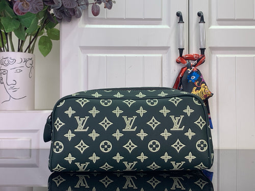 Louis Vuitton monogram toiletry bag in dark green with gold pattern, top zip