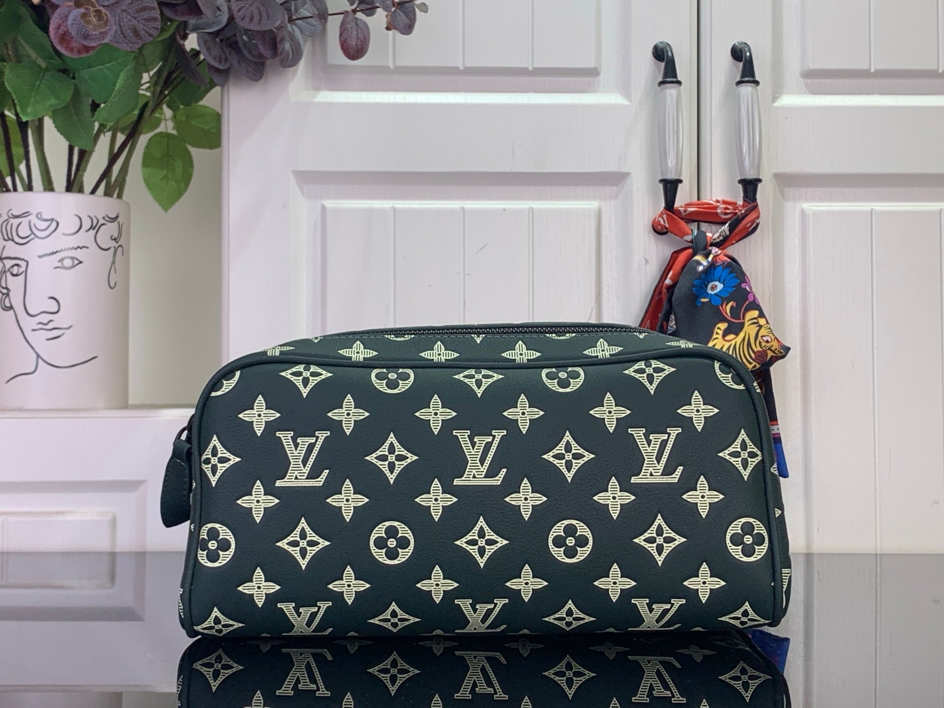 Louis Vuitton monogram toiletry bag, dark green with light gold pattern, zip top
