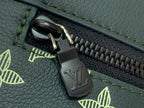 Louis Vuitton zipper pull with engraved LV logo on green leather trim