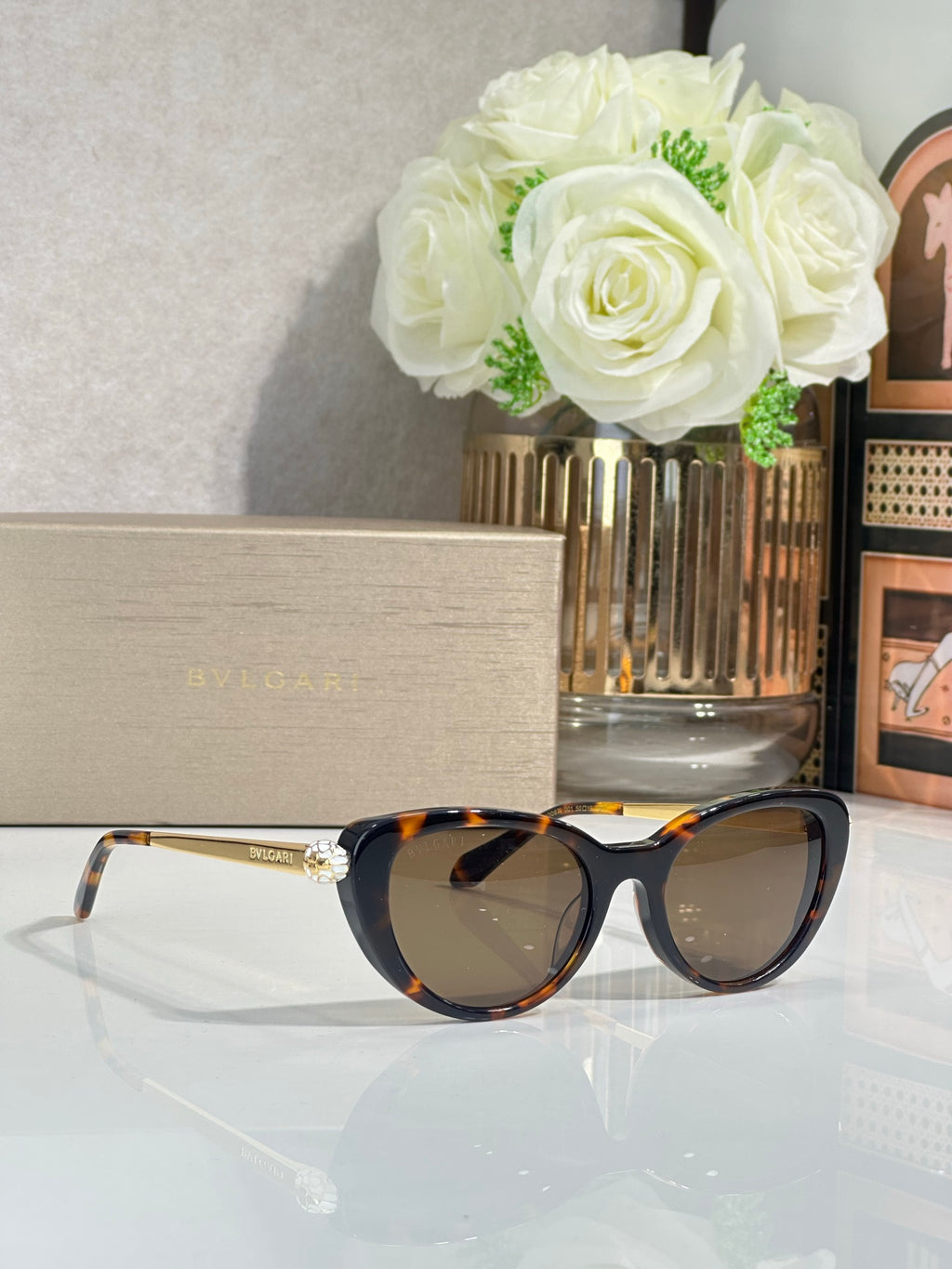 Bvlgari sunglasses with tortoiseshell-look frames and dark lenses, gold-tone temples