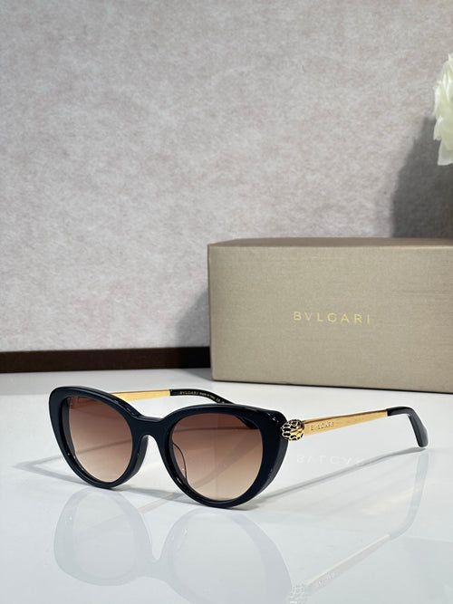 Bvlgari sunglasses with black round frames and dark gradient lenses, gold-tone temples