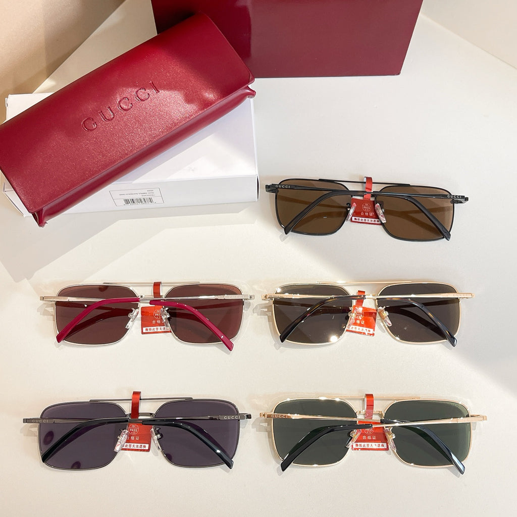 Set of four Gucci sunglasses with mixed frames and dark tinted lenses