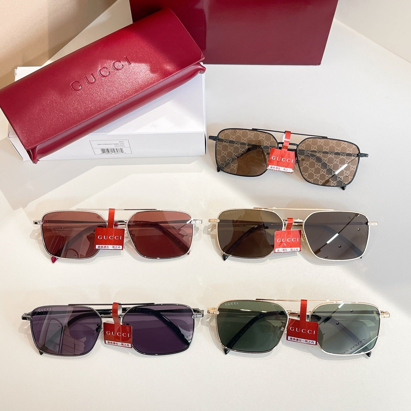 Set of four Gucci sunglasses with different frames and tinted lenses