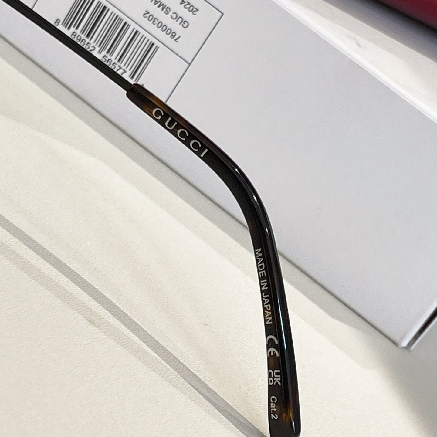 Black eyeglass temple with GUCCI and MADE IN PRC text