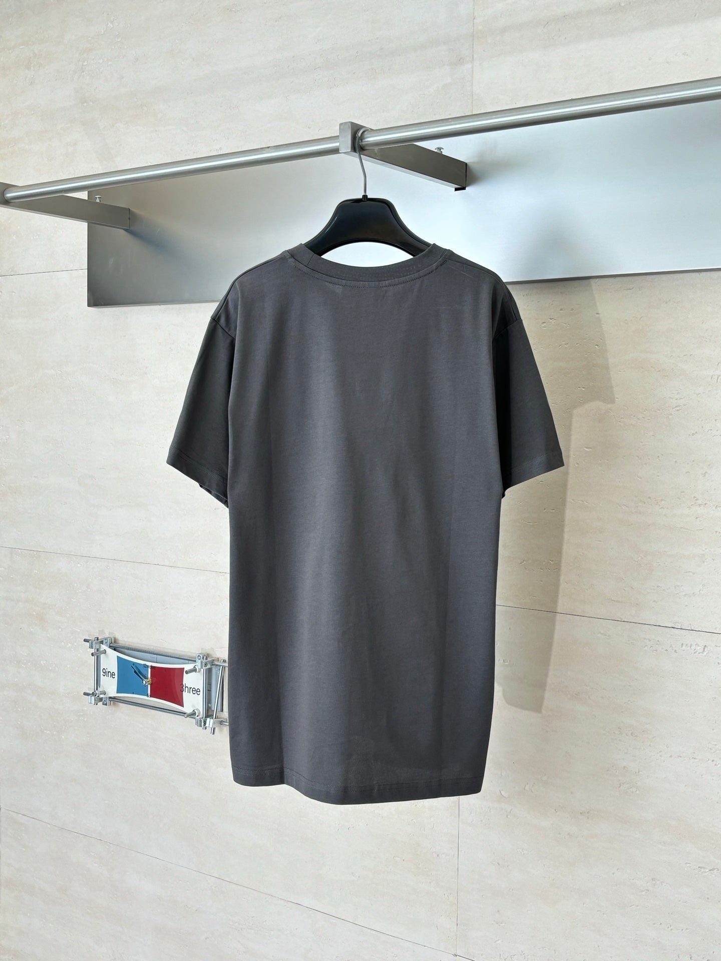 Gucci short-sleeve T-shirt back view in dark gray, plain design