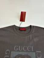 Gucci short-sleeve T-shirt neckline close-up in dark gray with GG logo