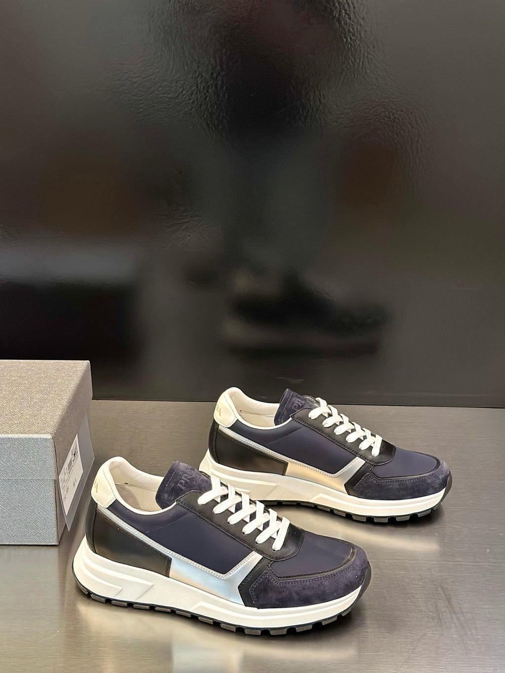 Prada unisex sneakers, navy and cream panels with white lace-up detailing