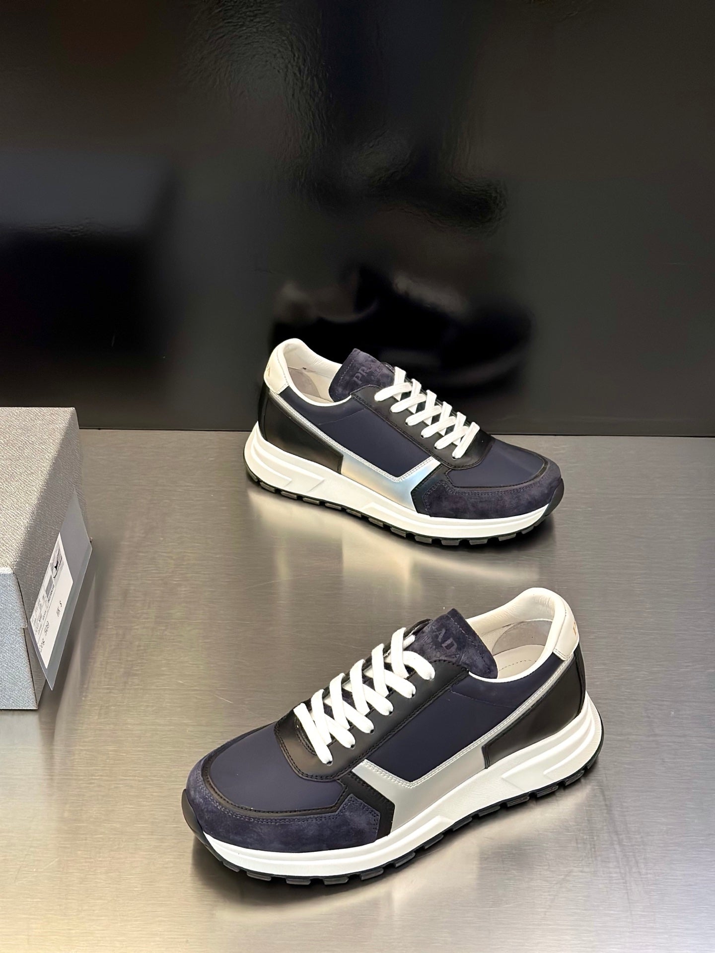 Prada unisex sneakers, navy upper with cream stripes and white lace-up