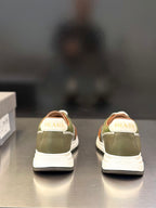 Prada unisex sneakers rear view with PRADA on heel tabs; olive green and white sole