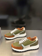 Prada unisex sneakers, two-quarter view; olive green, brown details, white laces