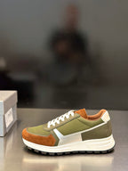 Prada unisex sneakers in olive green with brown panels and white laces, side profile