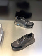 Prada unisex lace-up sneakers, two-tone dark gray and black; low-profile lace-up design