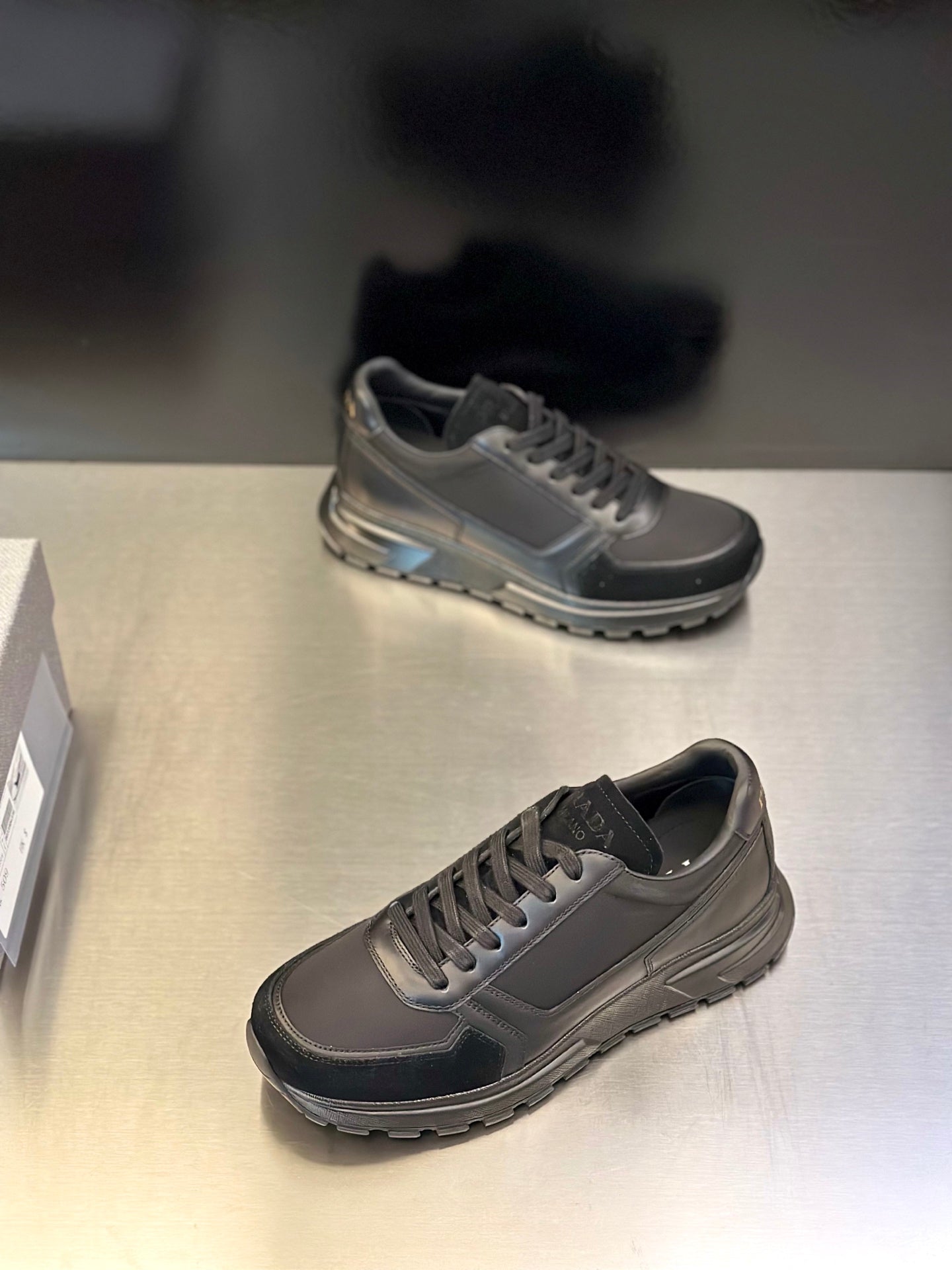 Prada unisex lace-up sneakers, two-tone dark gray and black; low-profile lace-up design