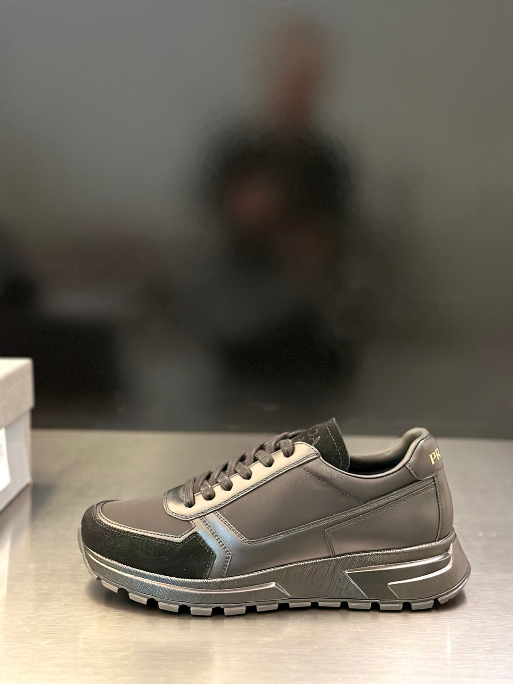 Prada unisex lace-up sneakers, light gray with dark side panels and chunky tread sole