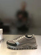 Prada unisex lace-up sneakers, light gray with dark side panels and chunky tread sole