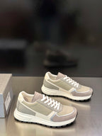 Prada unisex sneakers pair in light gray-beige with white lace-up design