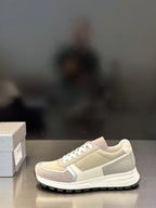 Prada unisex low sneakers in light beige with white laces and side trim detail