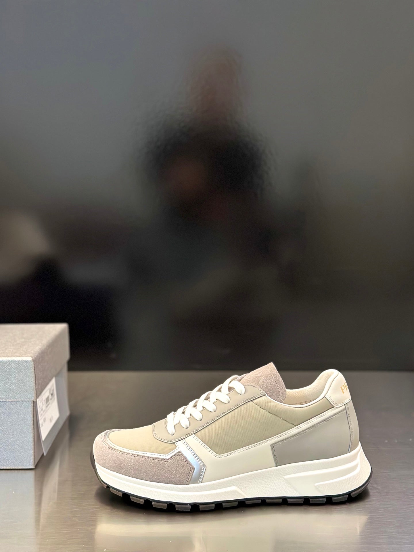 Prada unisex low sneakers in light beige with white laces and side trim detail
