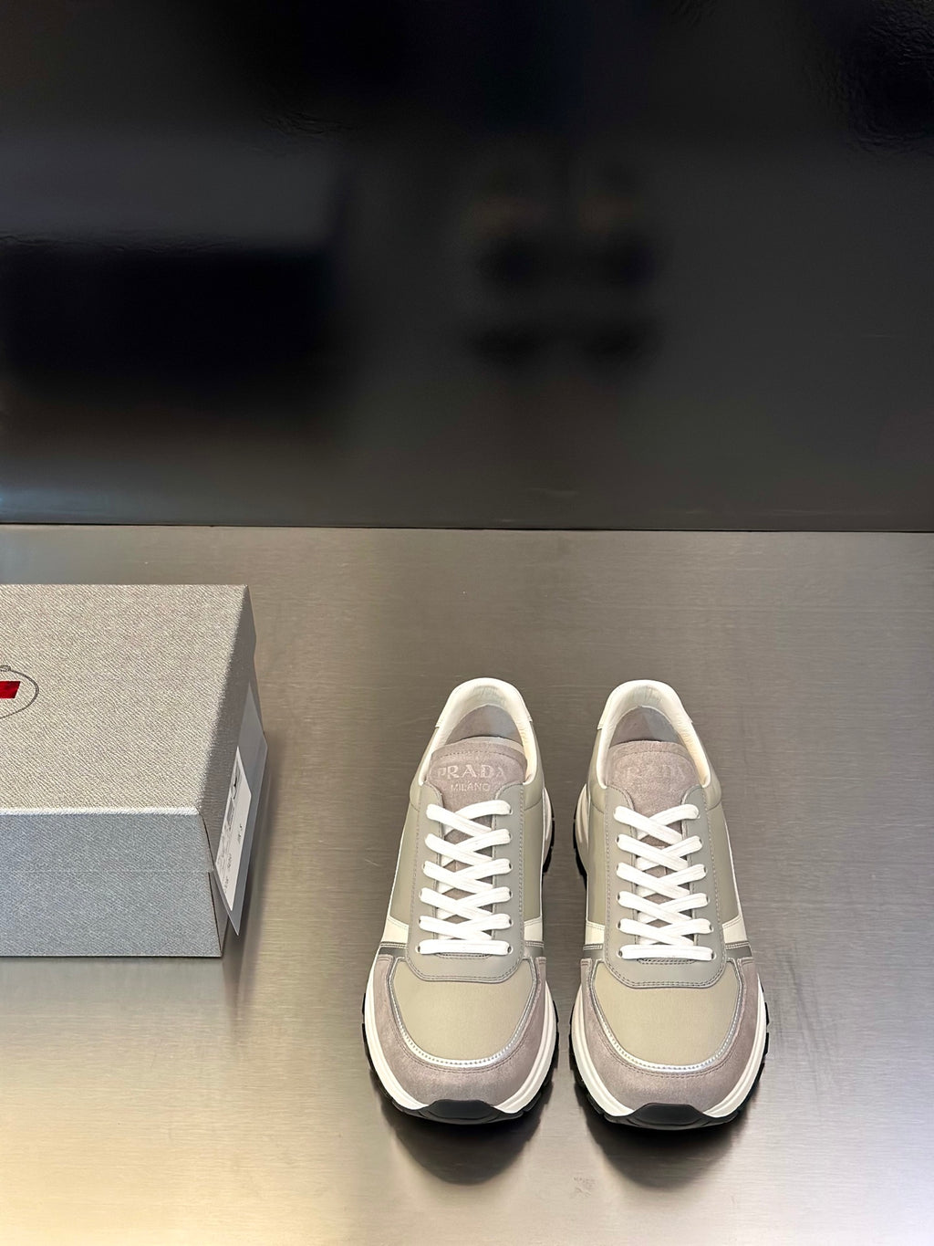Prada unisex sneakers in light beige with white laces and rubber sole
