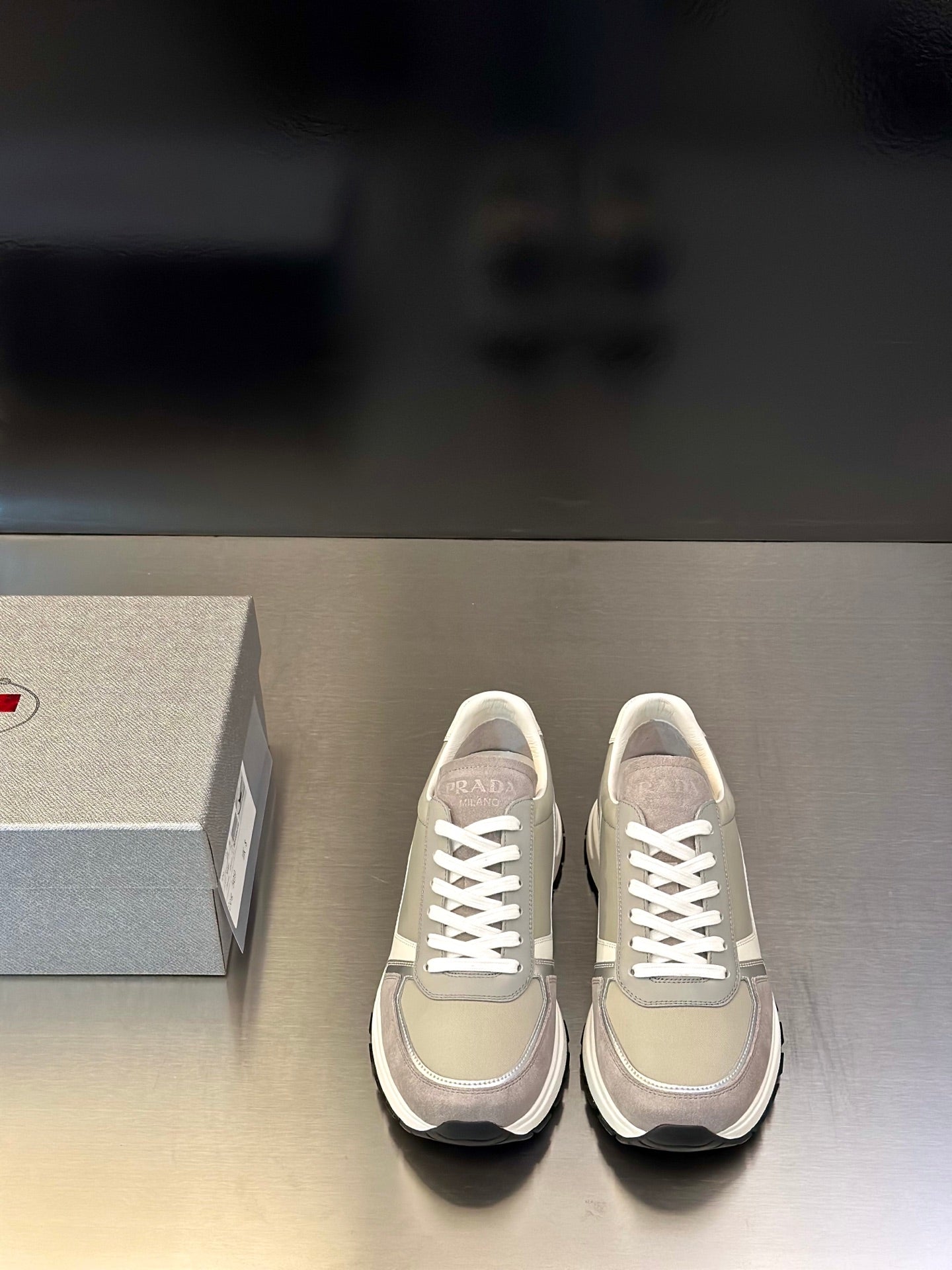 Prada unisex sneakers in light beige with white laces and rubber sole