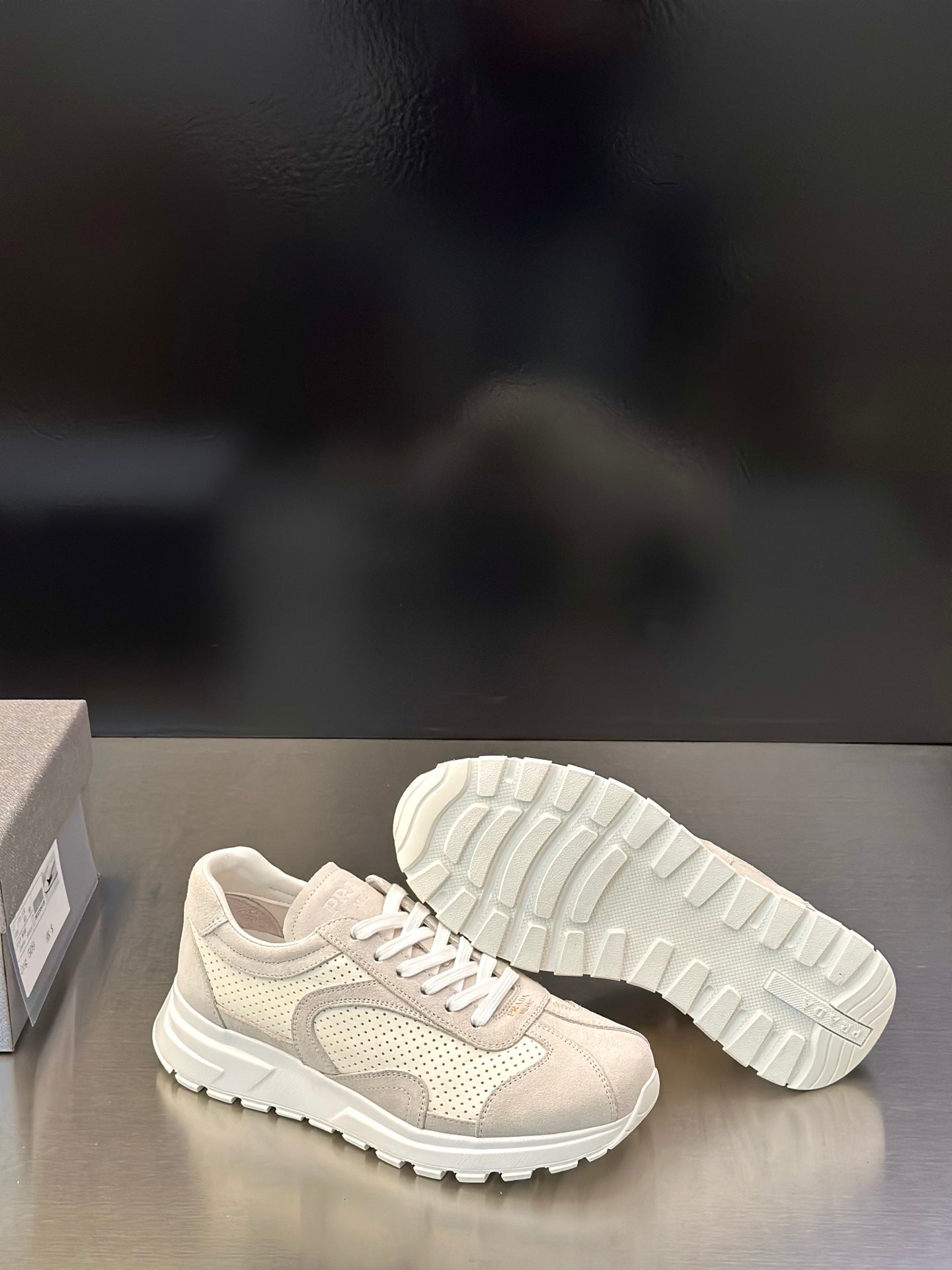 Prada unisex sneakers with outsole visible, light off-white lace-up shoes