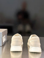 Prada unisex sneakers showing back heel tabs and PRADA logo on heel