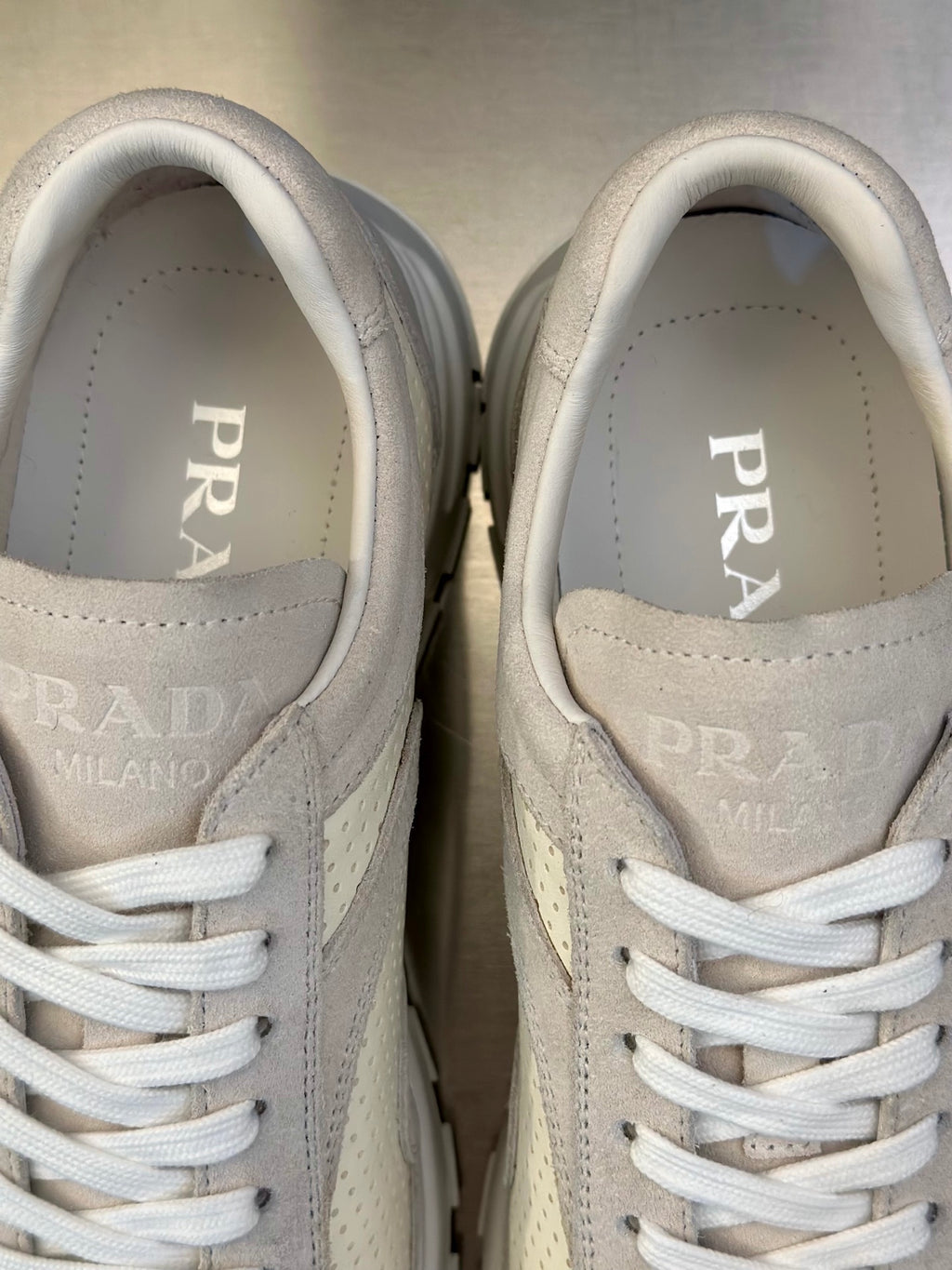 Prada unisex sneaker tongue and laces, interior lining with PRADA MILANO branding