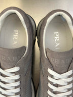 Prada unisex sneaker inner view, light gray suede with white laces and PRADA logo