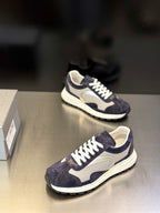 Prada unisex sneakers in dark navy with cream lining, white laces and thick sole