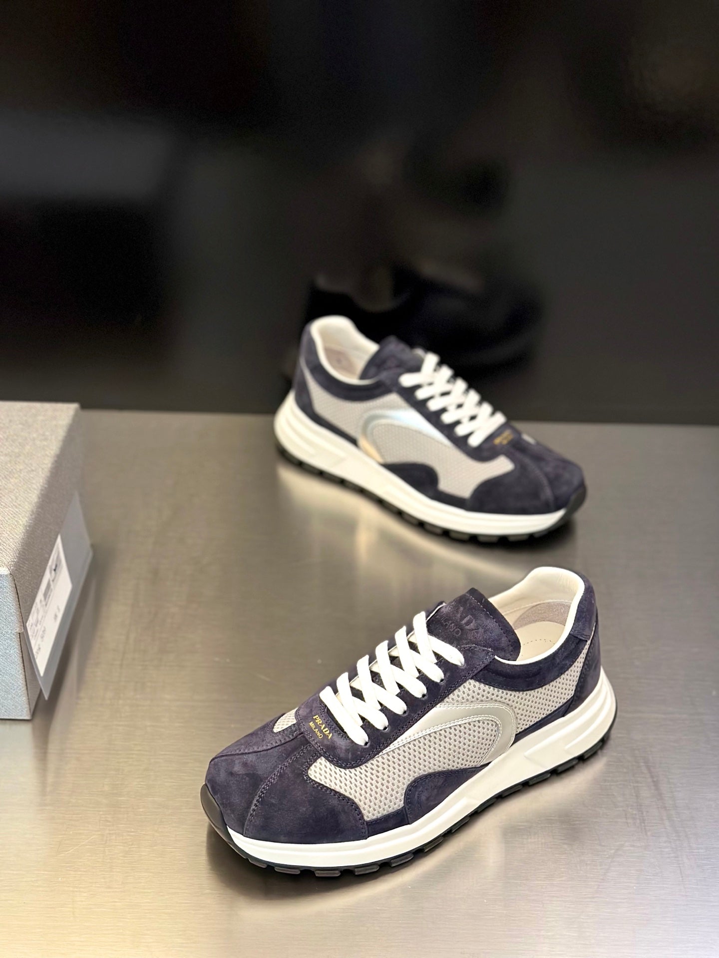 Prada unisex sneakers in dark navy with cream lining, white laces and thick sole