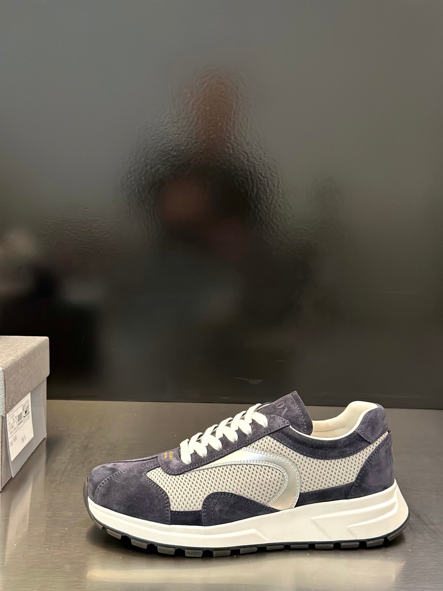 Prada unisex sneakers with navy suede and light mesh panels, white laces and sole