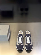 Prada unisex sneakers in dark navy with white laces and chunky white sole