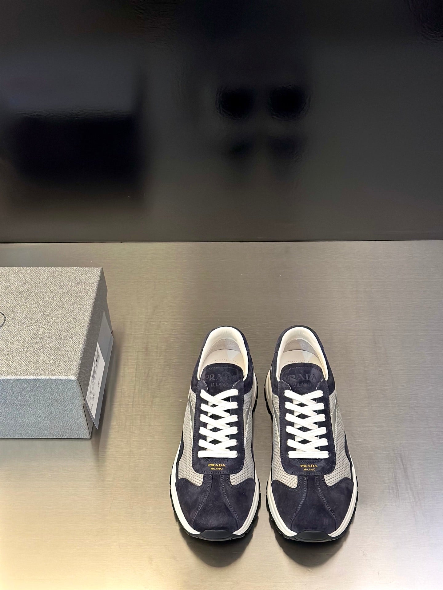 Prada unisex sneakers in dark navy with white laces and chunky white sole