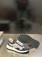 Prada unisex sneakers outsole view, dark navy upper with white laces and tread sole