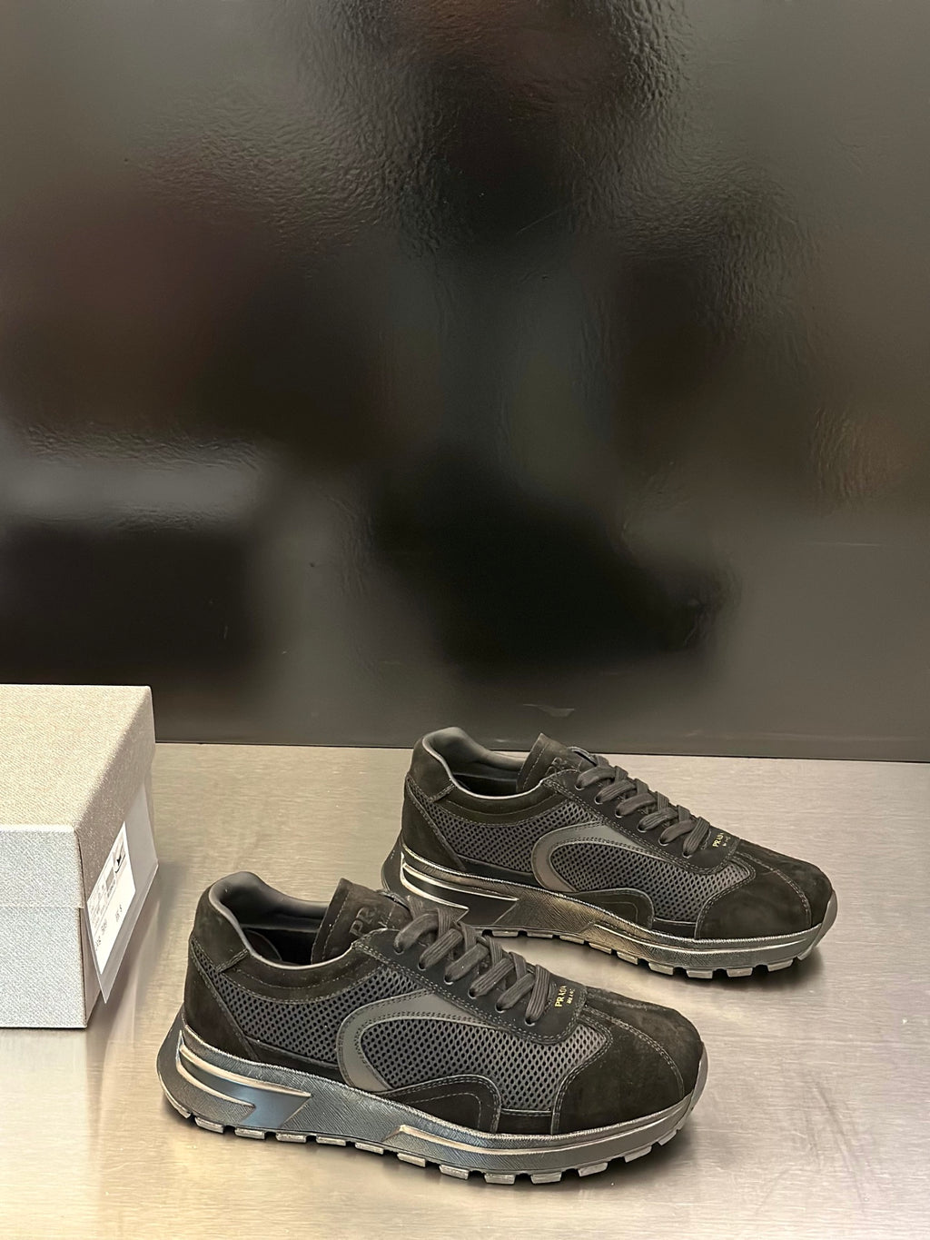 Prada unisex dark sneakers with lace-up closure, mesh and suede panels, chunky sole