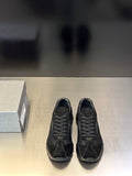 Prada unisex black sneakers with lace-up front and rubber sole