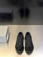 Prada unisex black sneakers with lace-up front and rubber sole