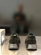 Prada unisex sneakers heel view with suede texture and Prada logo label