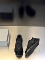 Prada unisex lace-up sneakers with dark panels and thick rubber sole