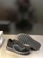 Prada unisex sneaker with treaded outsole shown and lace-up upper
